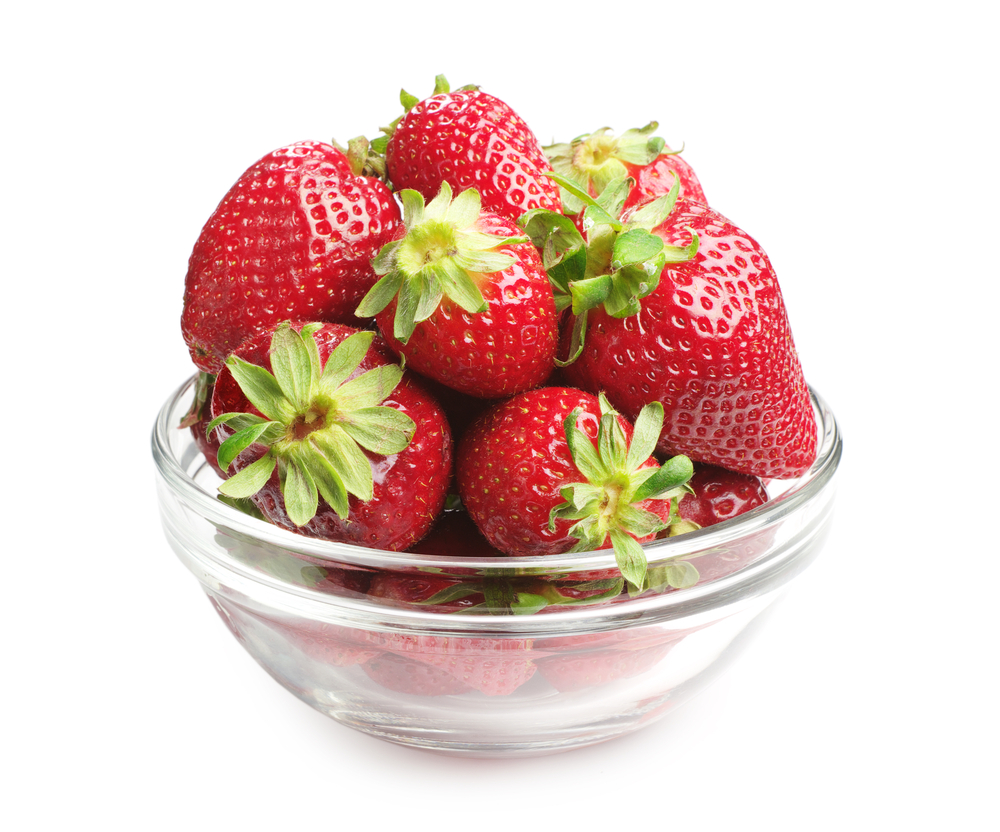 Clear bowl of whole strawberries