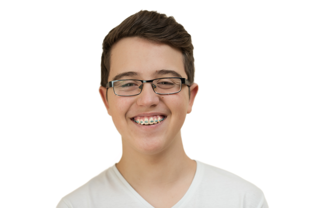 Teenage boy with braces smiling