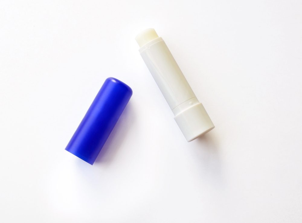 Chaptick lid next to chapstick