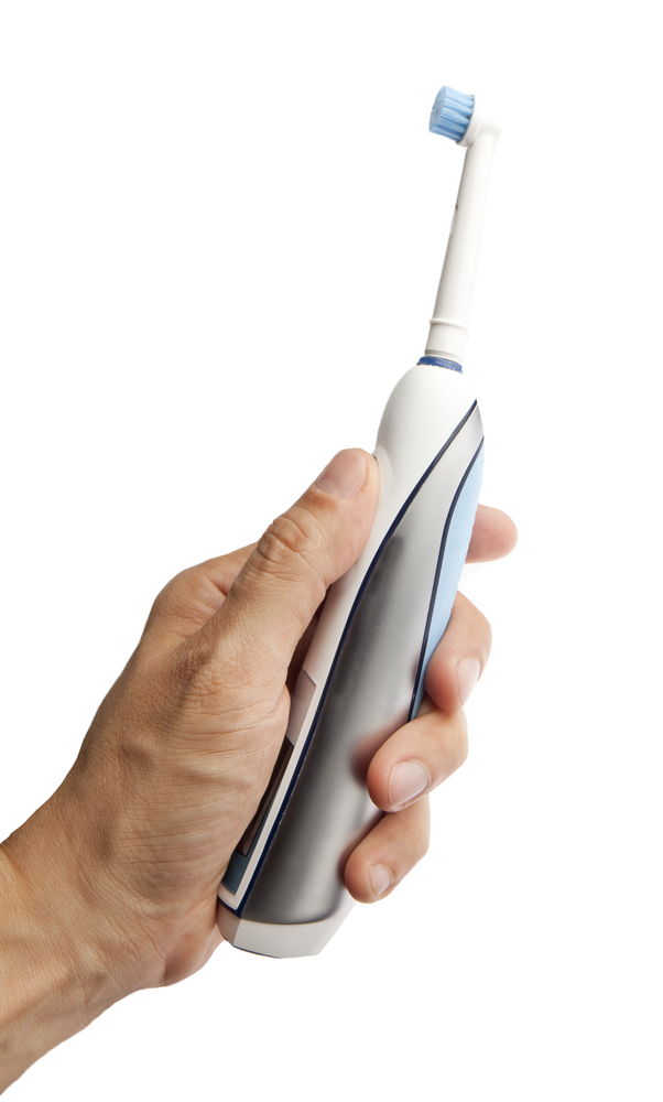 Electric toothbrush in man's hand