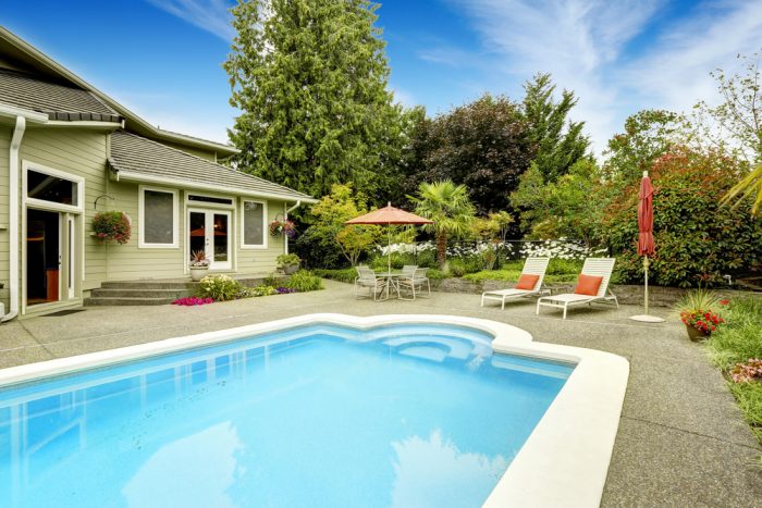 backyard swimming pool and house