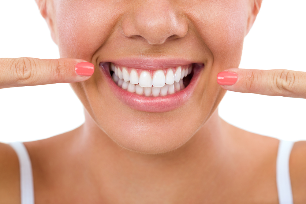 A woman with healthy beautiful teeth and gums