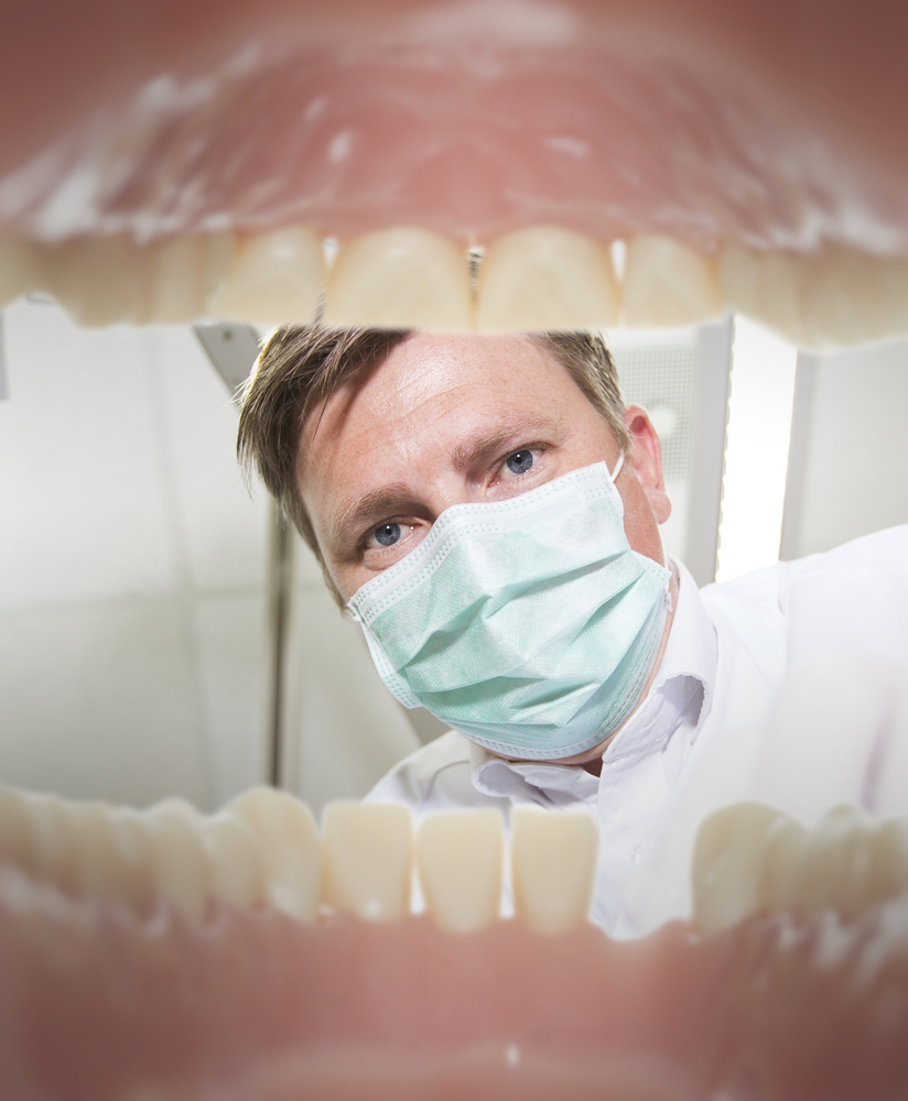 View of a dentist from the inside of mouth, depicting a fear of the dentist