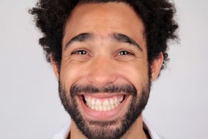 smiling man with no chipped teeth