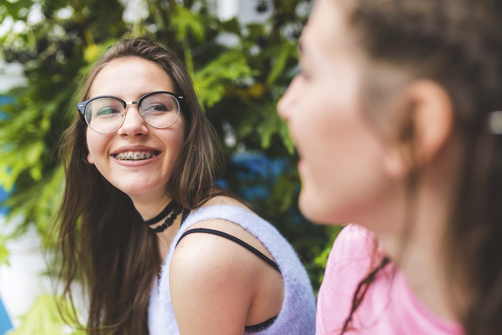 happy teenager enjoying healthy braces