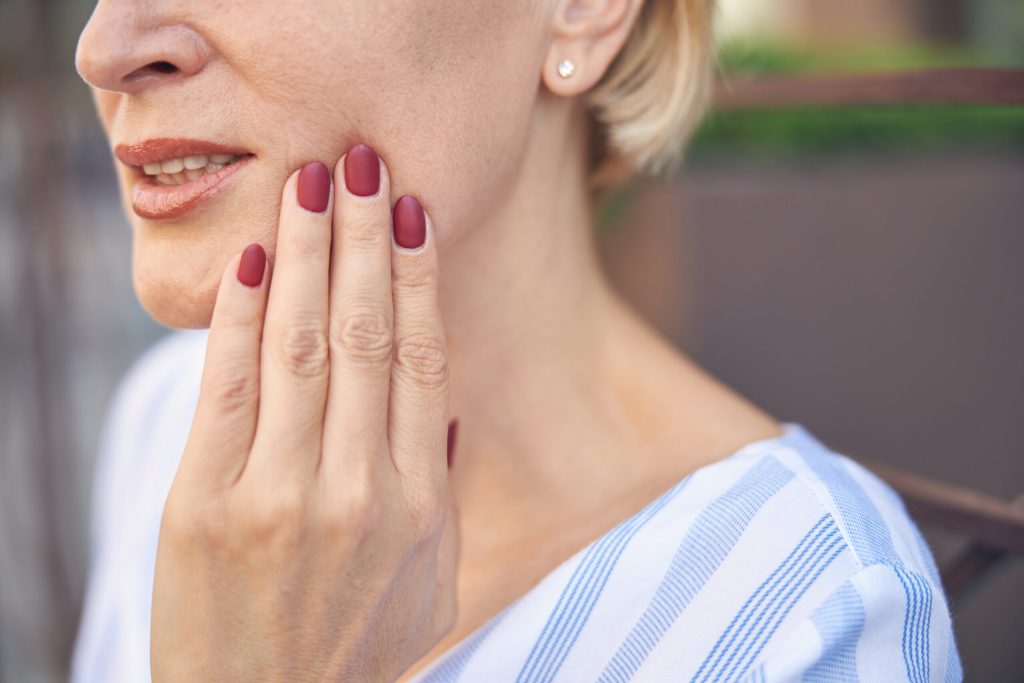 woman suffering from dental pain