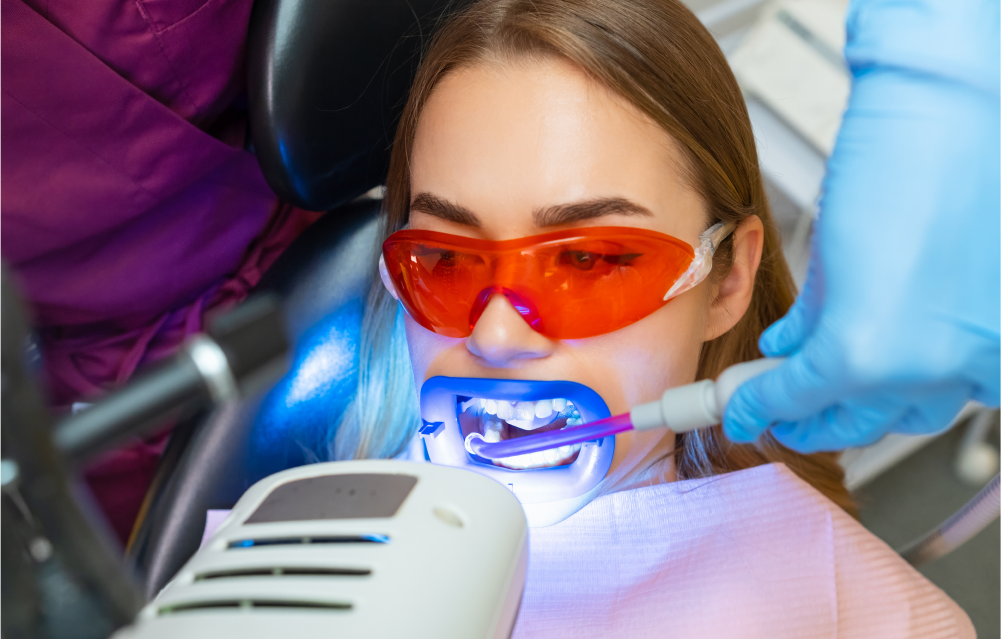 A women receives a teeth whitening treatment using Zoom! laser technology.