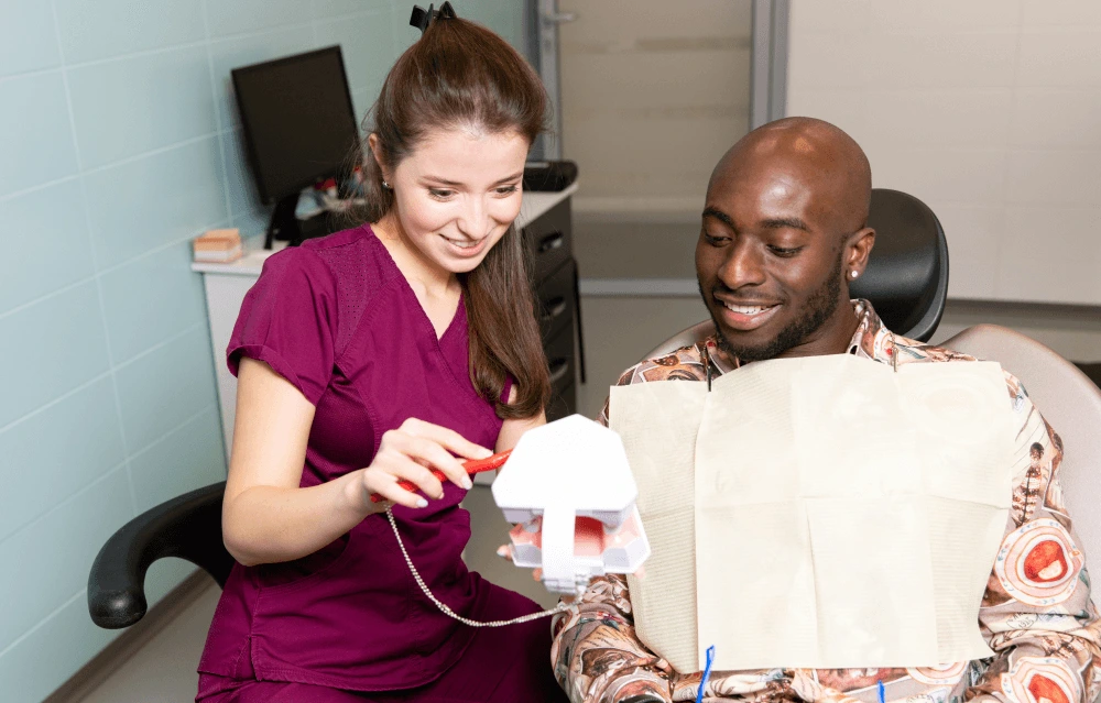 dentist discussing treatment models with a patient