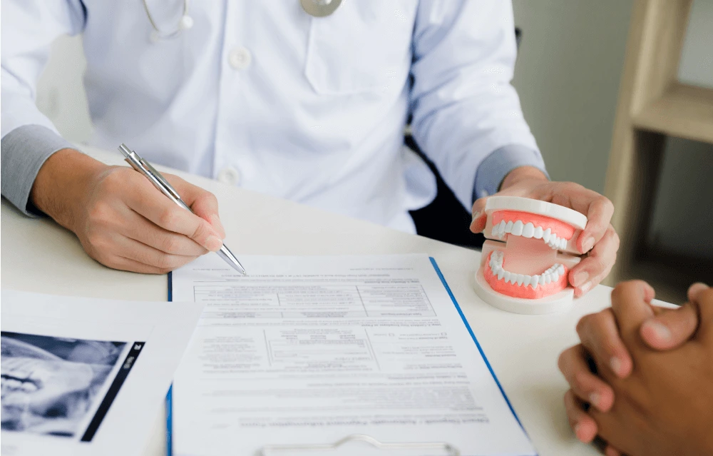 Dental insurance forms being filled out